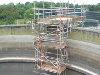 A photo of scaffolding allowing access into a tank