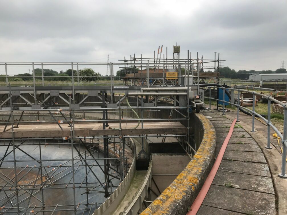 An image of cantilever scaffolding forming a bridge in across a sewage tank