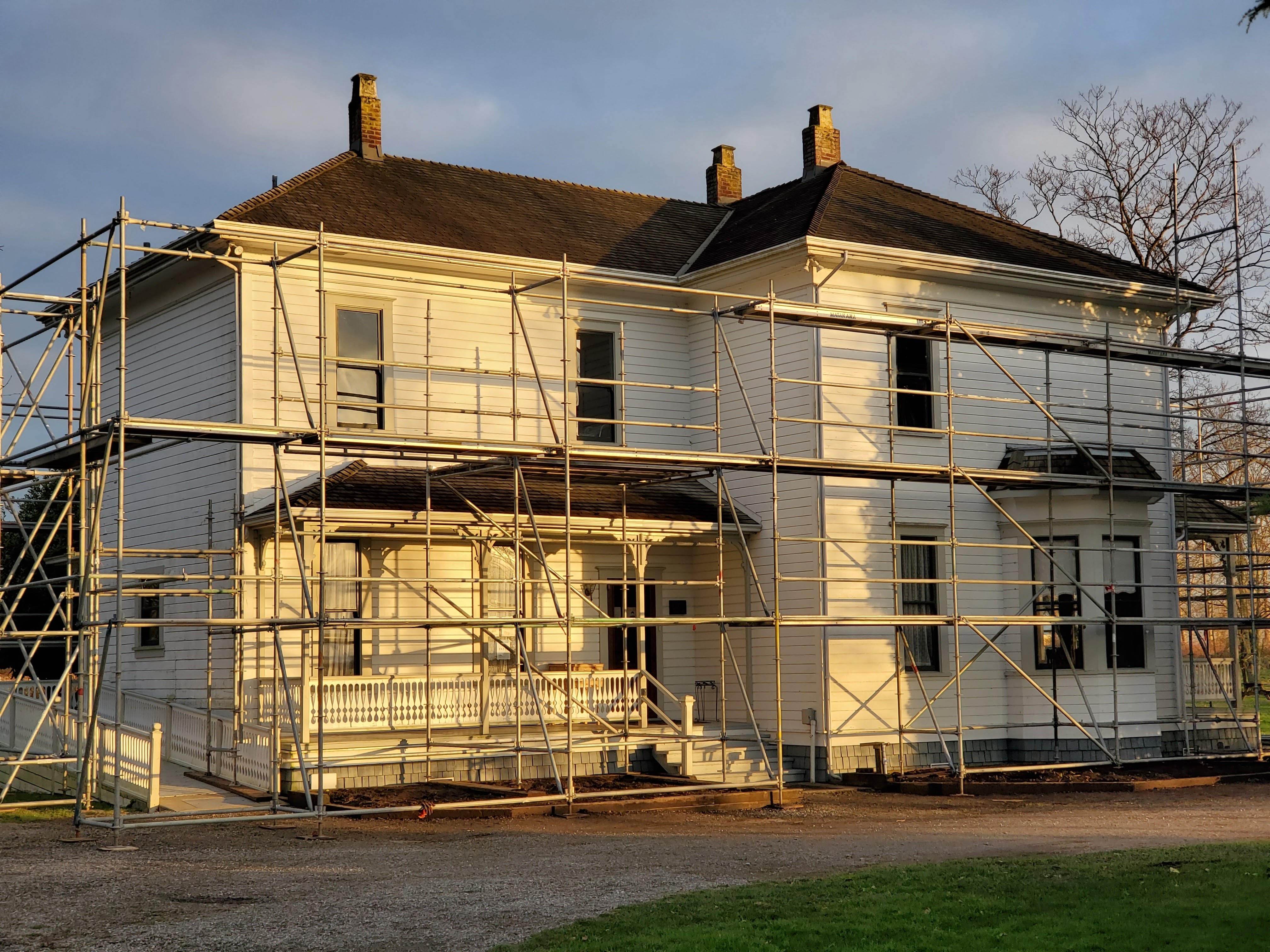 An image of a house surrounded round scaffolding
